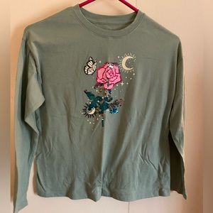 Olive green girls long sleeve shirt with sequin flower
design. Size large